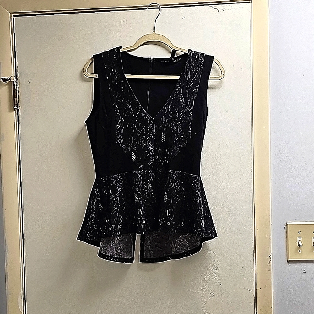 Black peplum top with lace detail